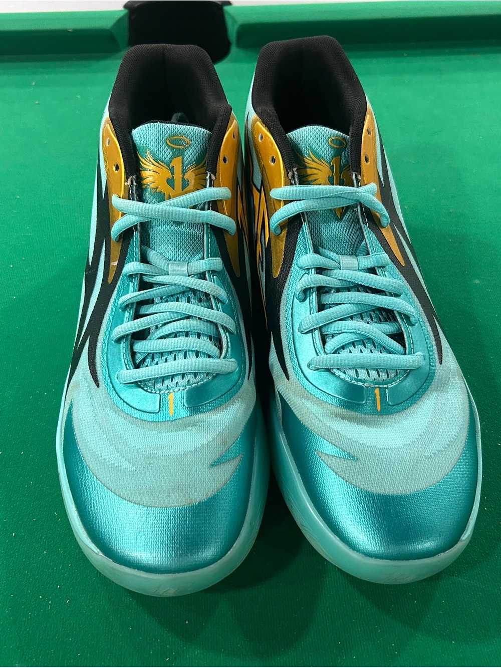 Puma Teal Athletic Shoes with Yellow Accents